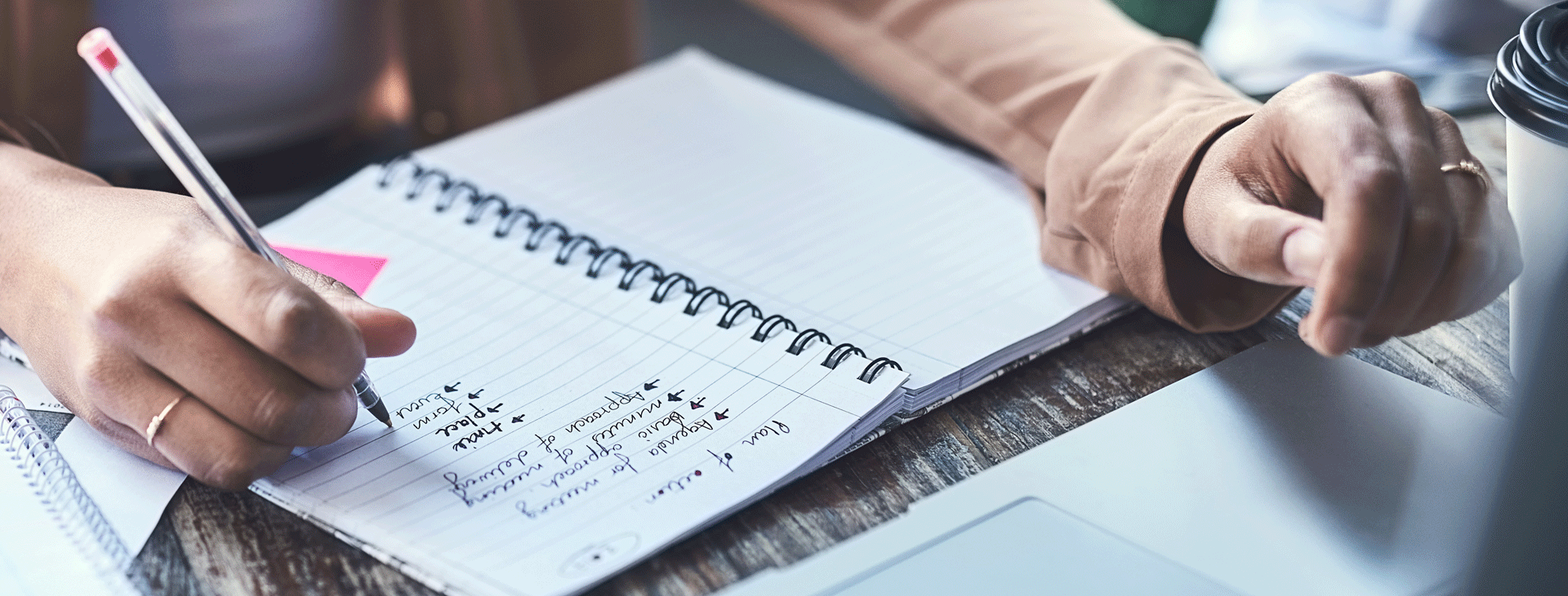 Person writing in a notebook
