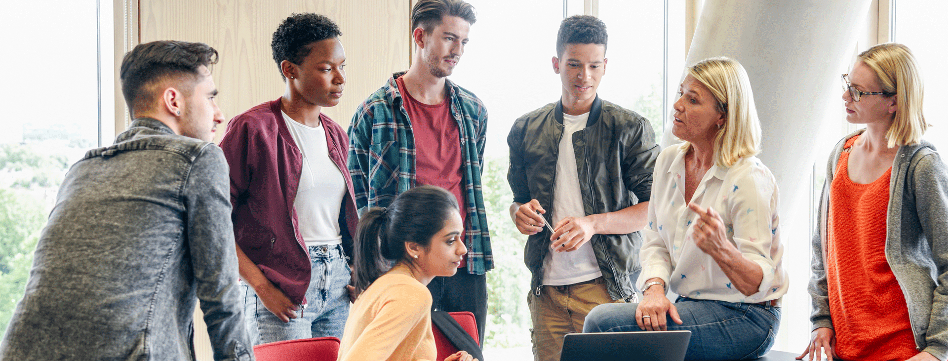 A group of students listening to an instructor