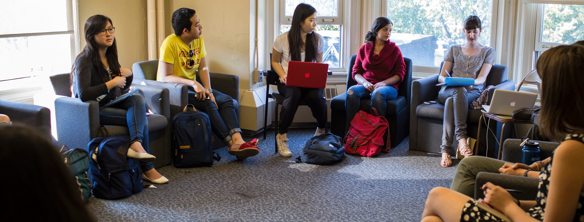 A group of students sitting in a circle at 21 Sussex