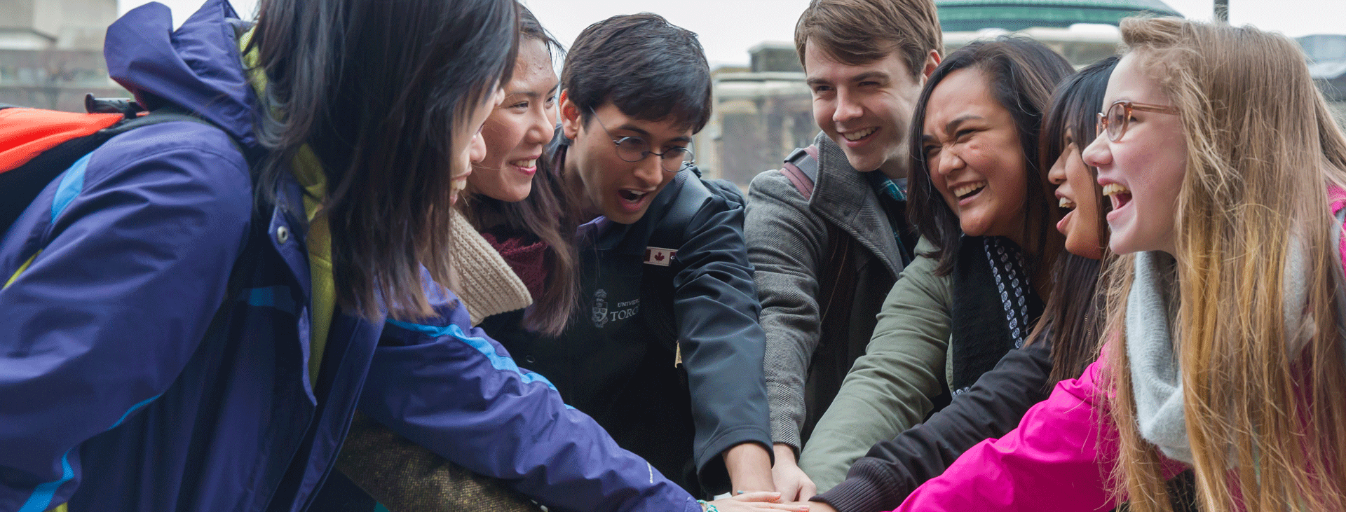A group of students doing group high 5