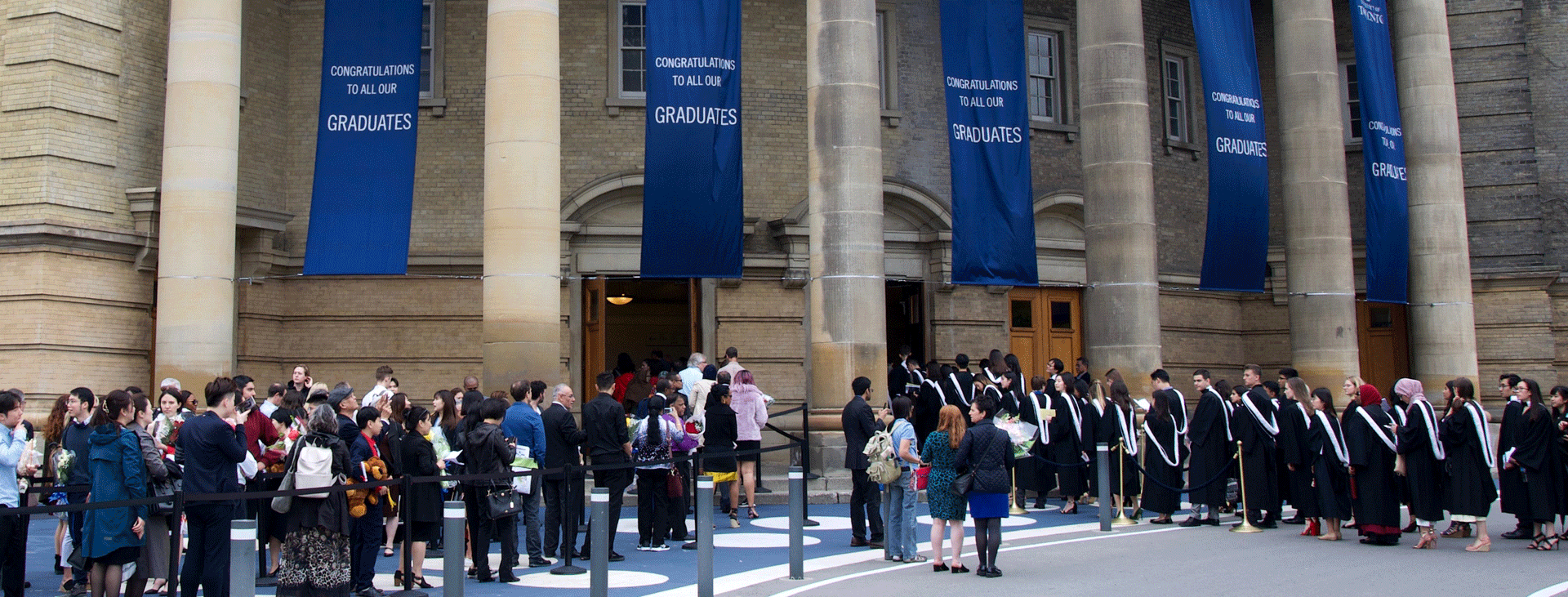 New U of T graduates lining up at Convocation Hallup