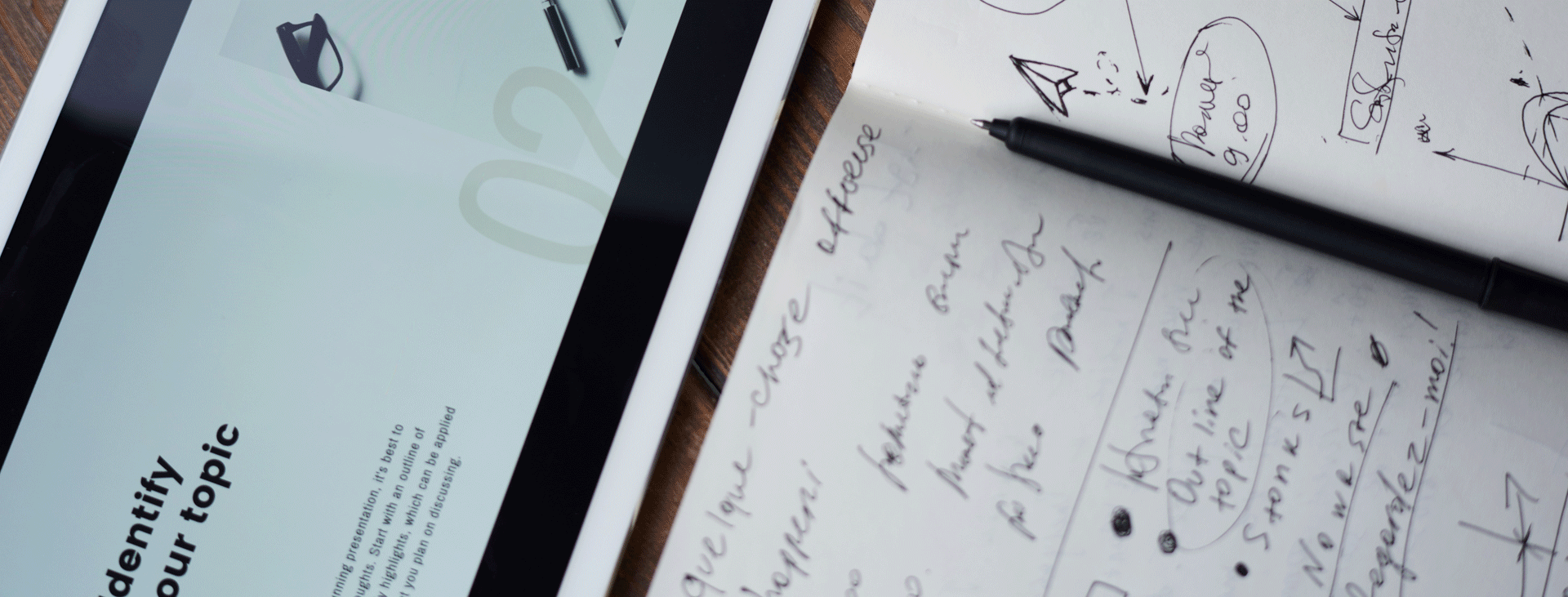 Paper with writing, pen and tablet