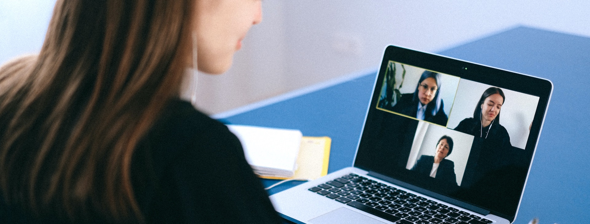 Woman at desk on video call